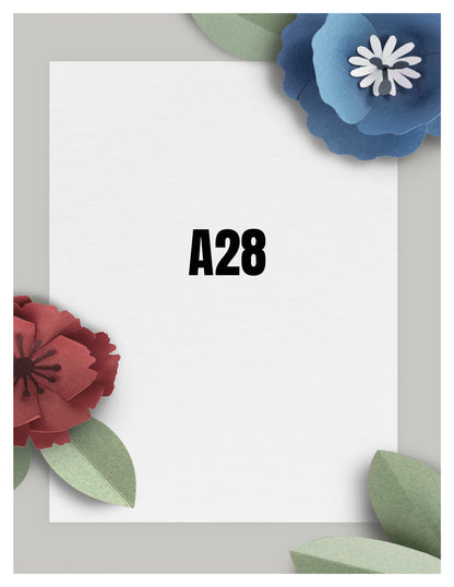 White card with 'A28' text, surrounded by red, blue, and green paper flowers on a light gray background.